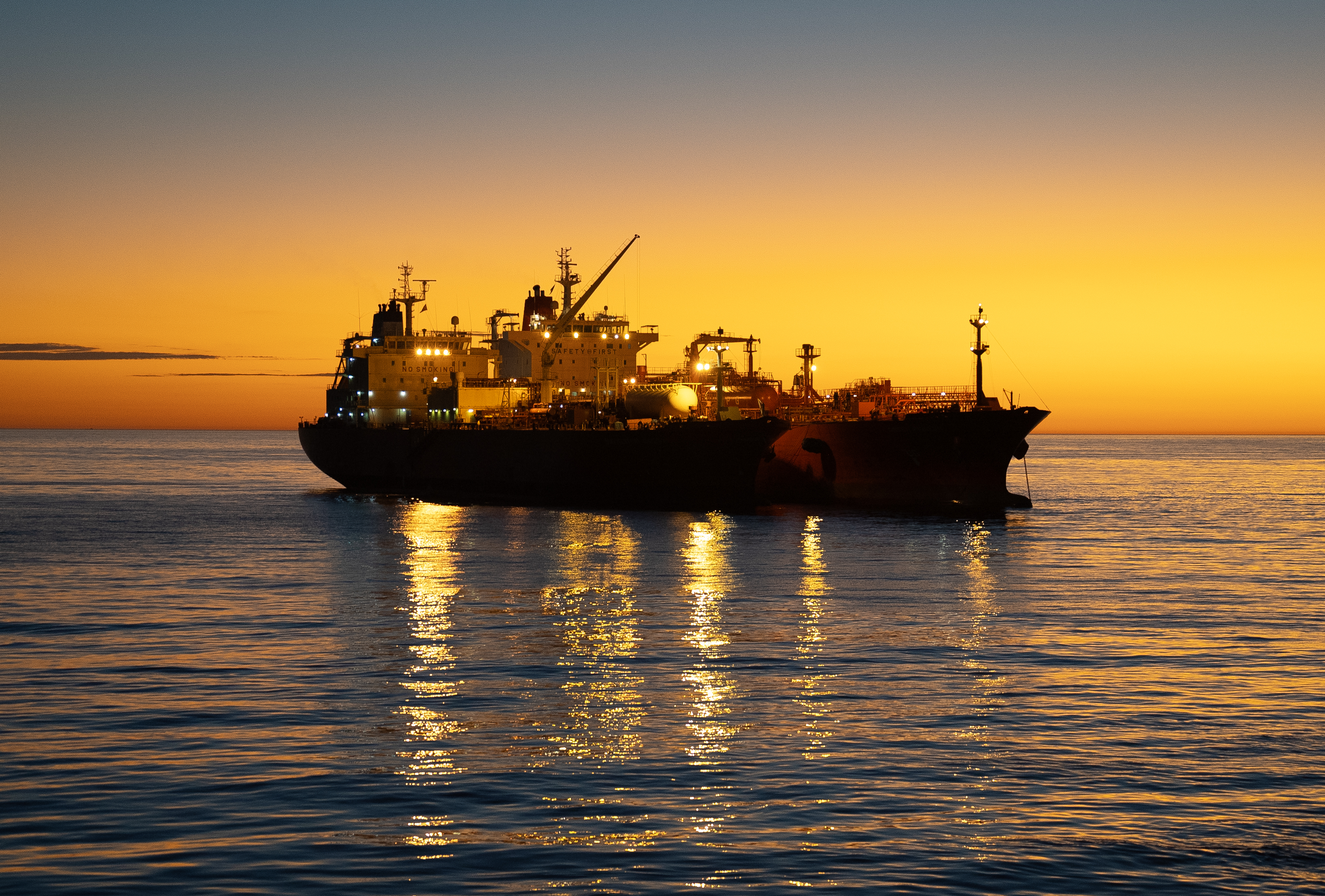 Navigator Global And The Green Pioneer At Dusk At The Outer Anchorage Of Port Dampier